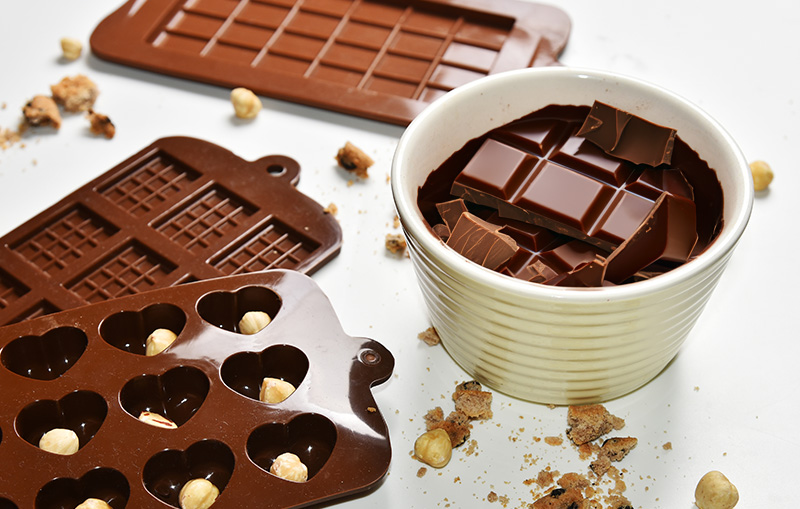 Preparing the chocolate for melting and filling silicone moulds