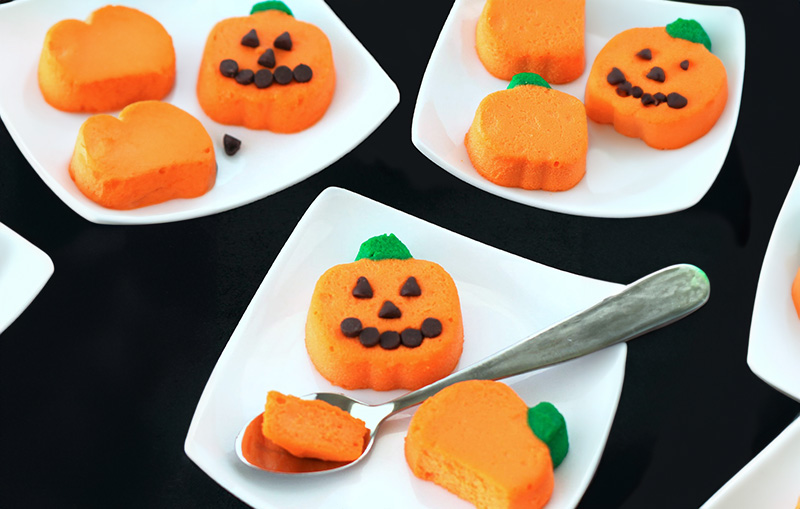 Mini pumpkin themed cheesecakes on plates