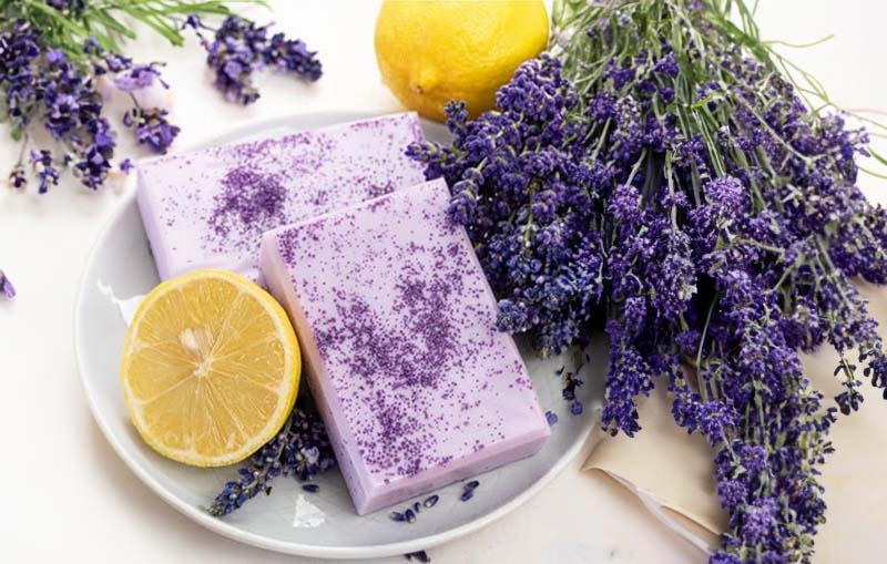 Home made soap surrounded by lemon and lavender