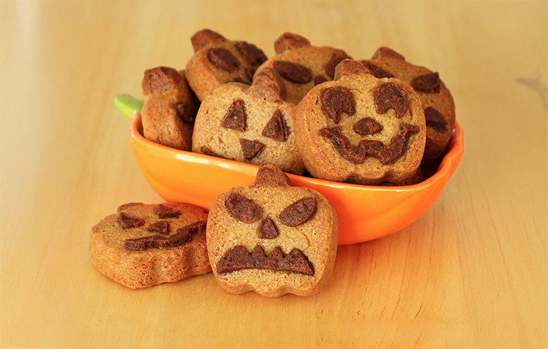 Jack-o'-lantern pumpkin cookies, a simple and fun Halloween baking idea.