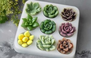 A silicone mold filled with detailed polymer clay succulents in green, purple, and yellow hues, highlighting the beauty and versatility of polymer clay molds.