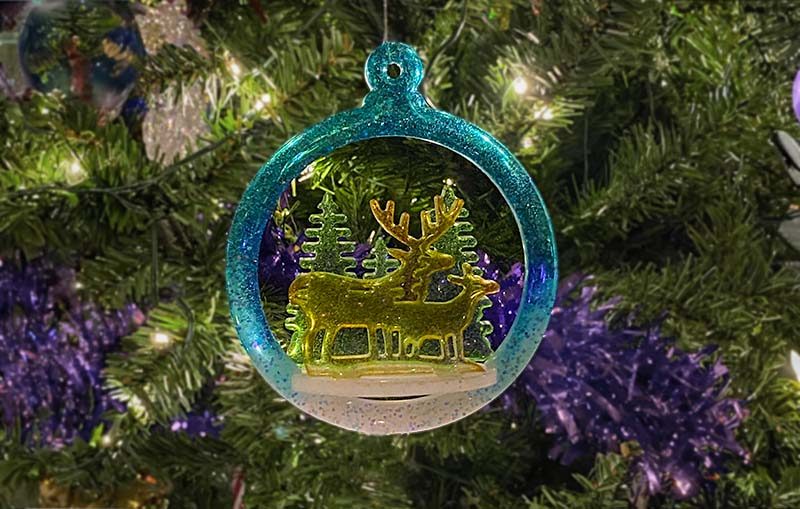 Resin Christmas Tree Decoration hanging on a Christmas Tree