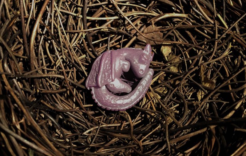 Hand made Polymer Clay baby Dragon Curled up in a nest